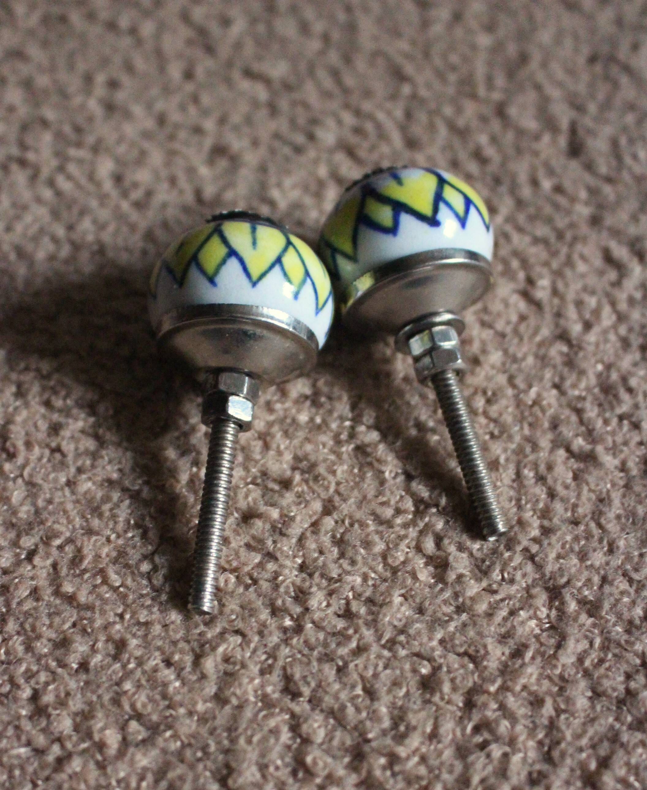 Pair of blue, yellow and white porcelain drawer cupboard door knobs