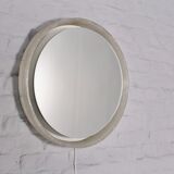 Bright round mirror in plexiglass