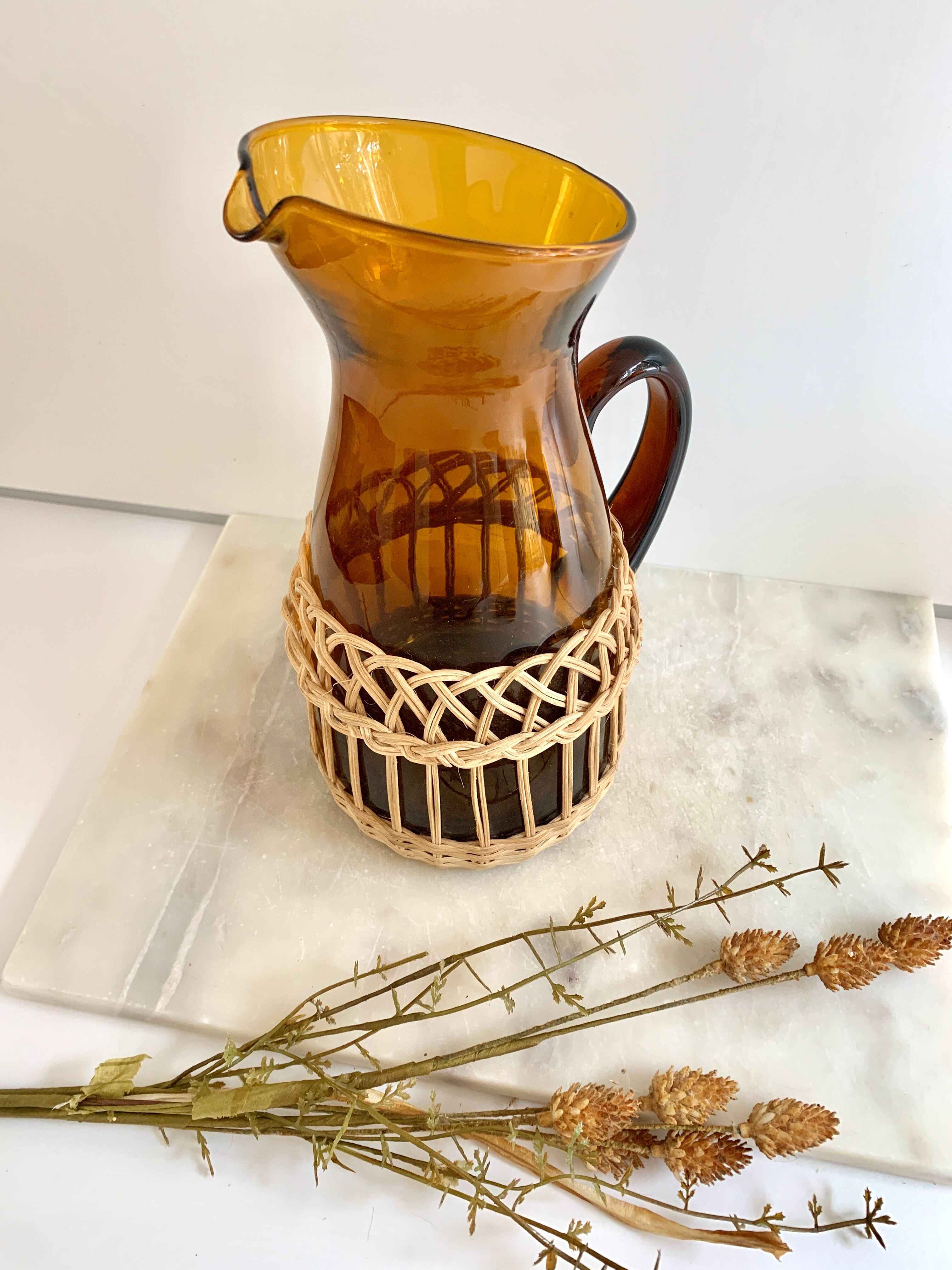 Amber glass and wicker carafe