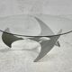"space age" coffee table. Steel legs, glass slab. Circa 1970