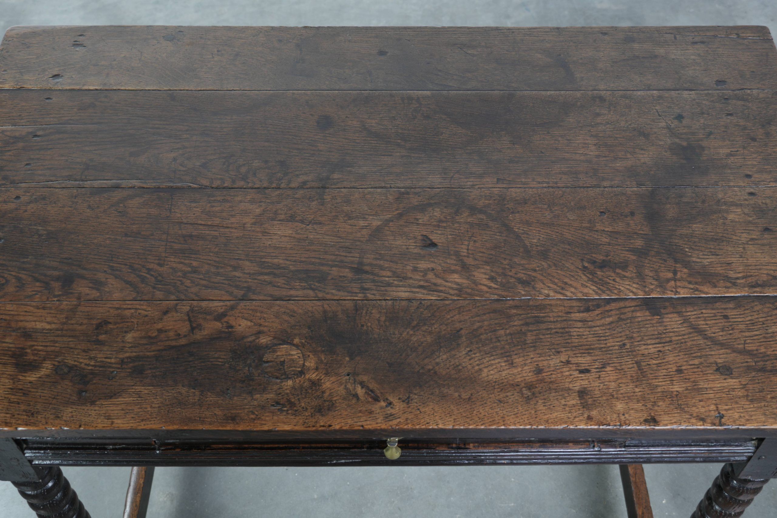 Antique English oak side table from the 18th century with bobbin legs