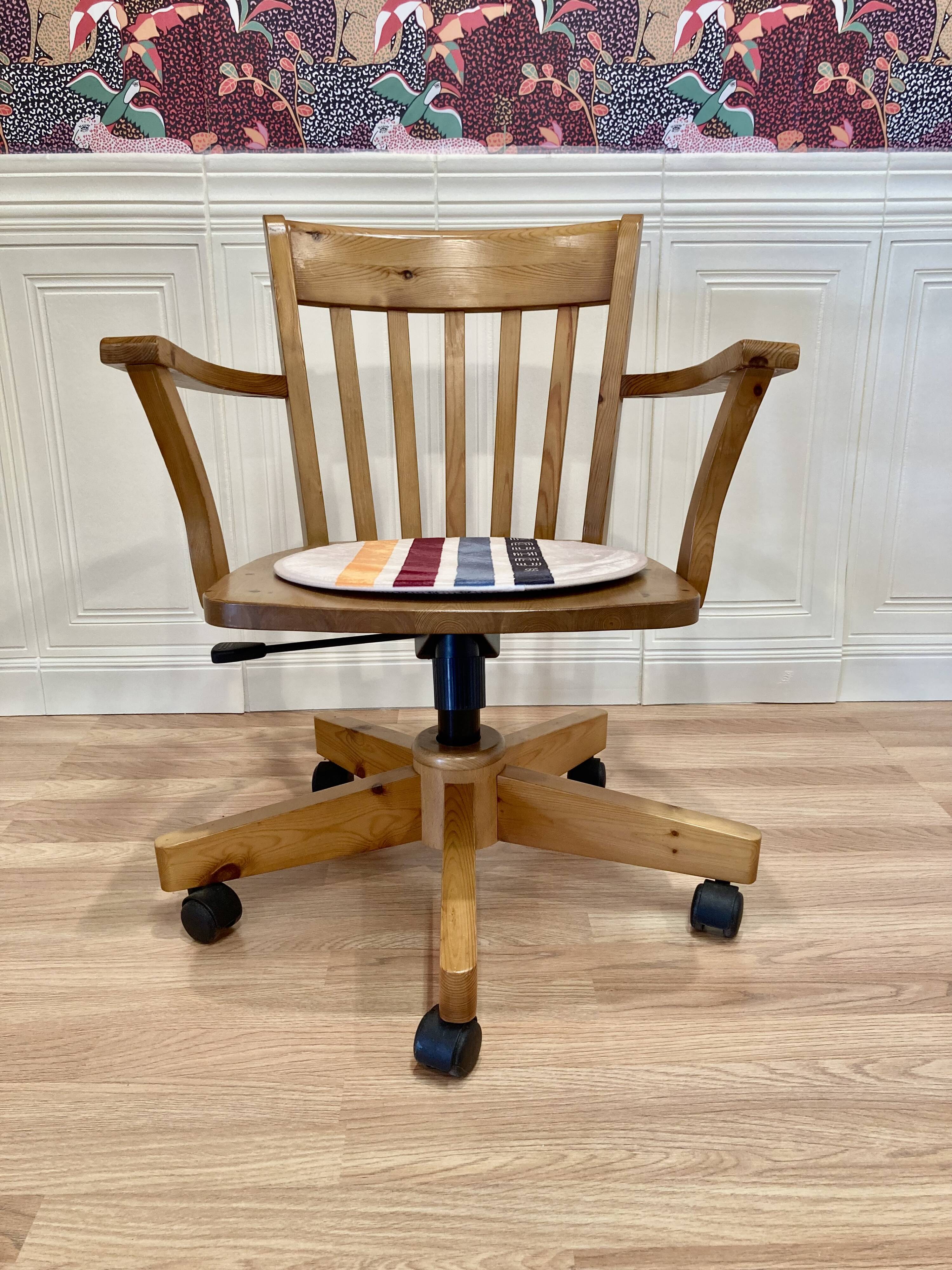 Solid wood swivel and reclining armchair.