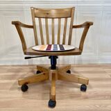 Solid wood swivel and reclining armchair.