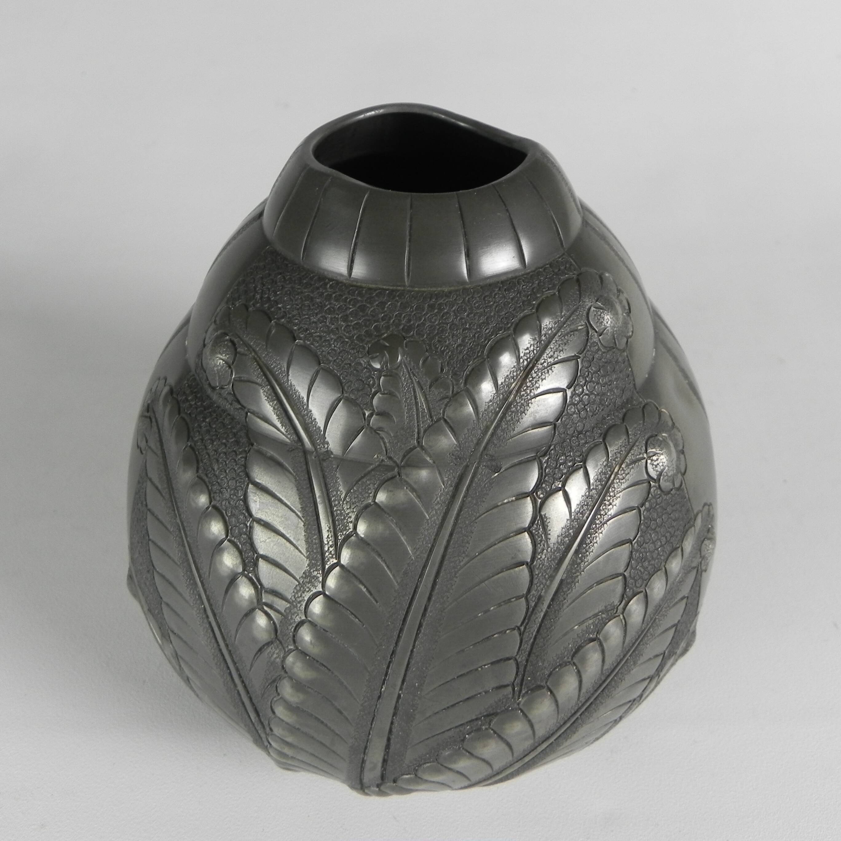 Art Nouveau pewter vase, signed PETIZON, early 20th century.