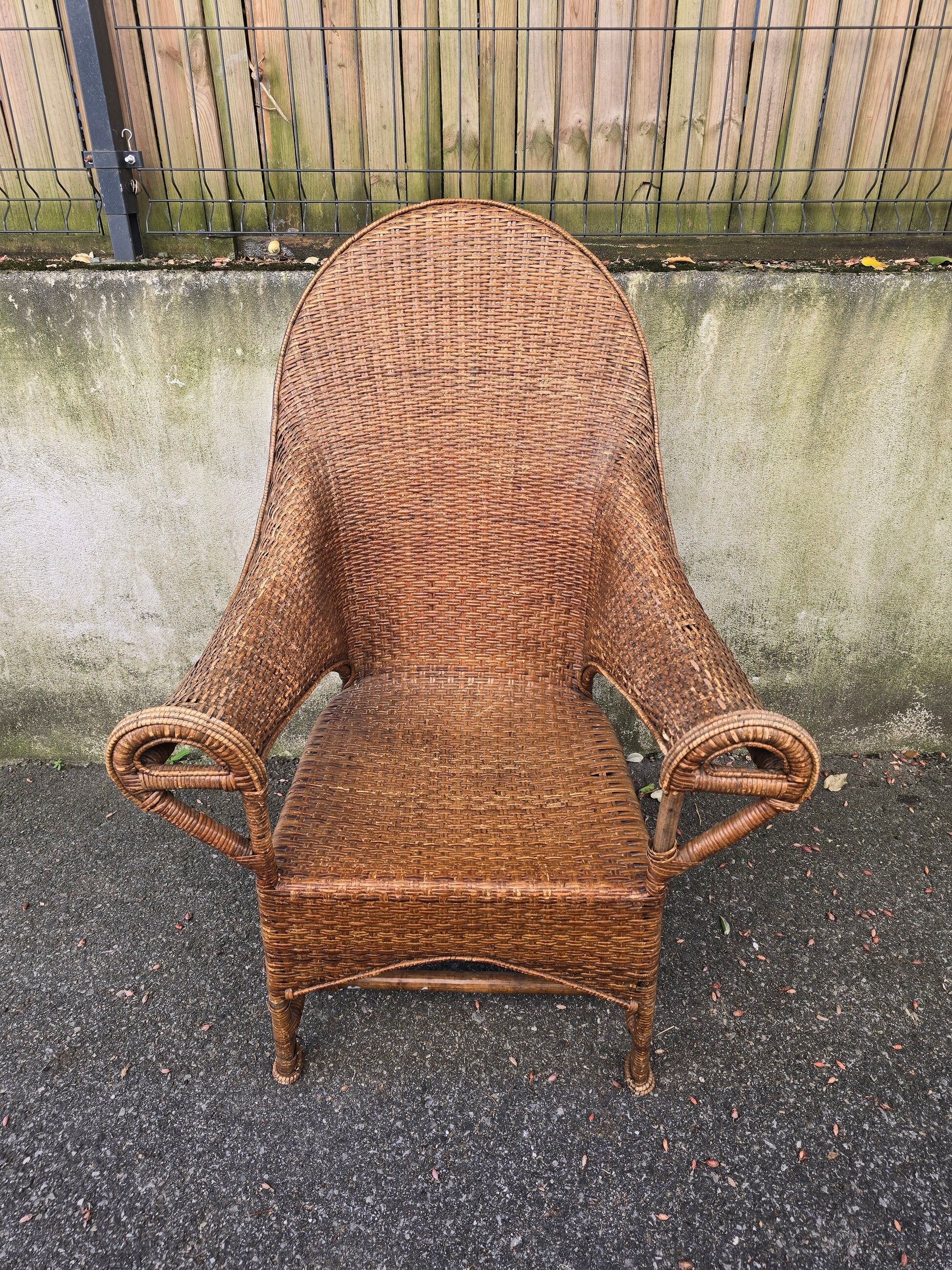 Arts & Crafts armchair in wicker and rattan attributed to Dryad & Co, UK, circa 1920.