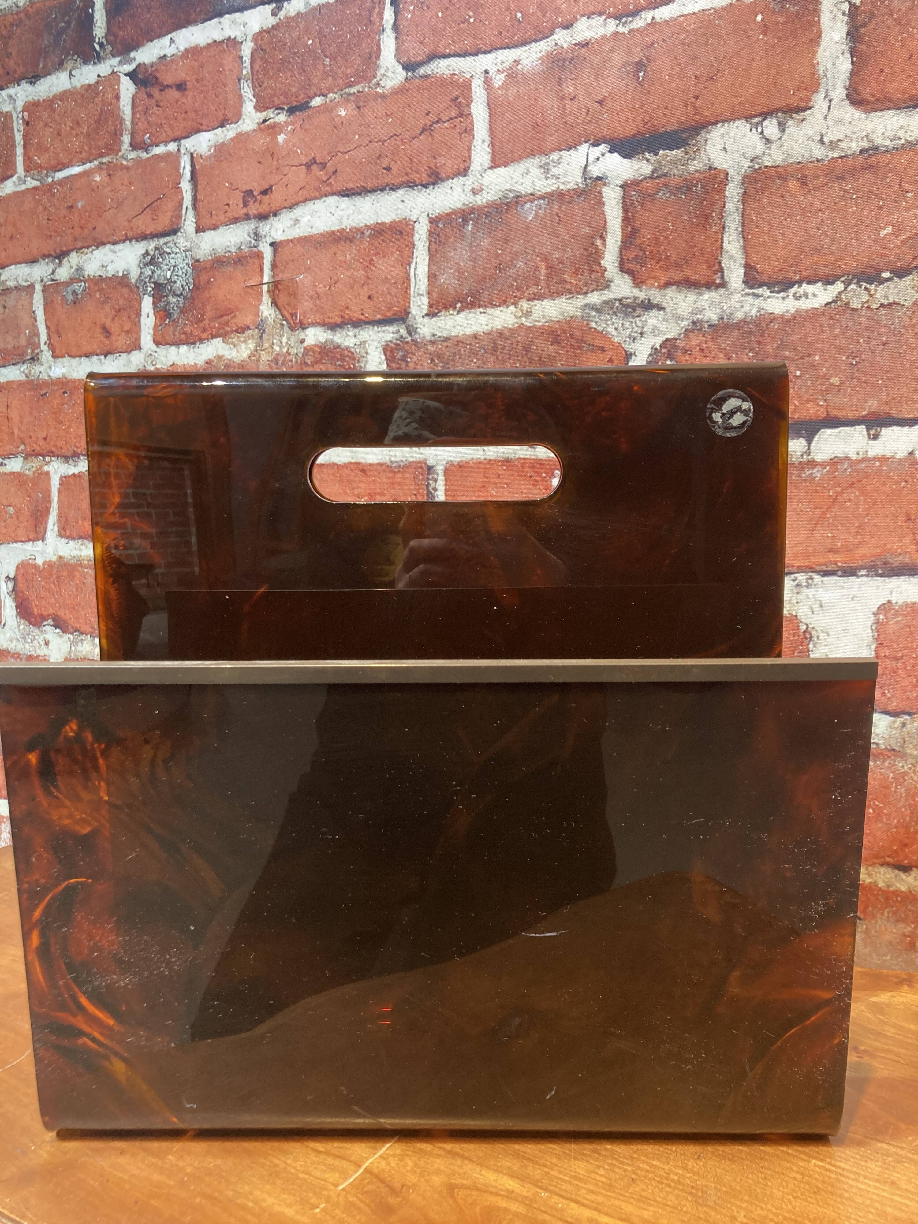 Brown plastic magazine holder with handle