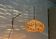 Mid-century modern Danish extendable cantilever wall lamp with a rattan shade, 1960s.