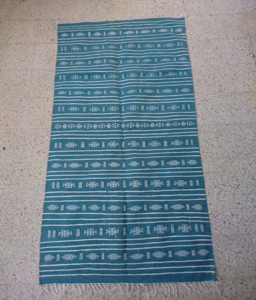 Hand-woven blue and white kilim rug in natural wool