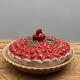 A trompe l’oeil strawberry pie dish