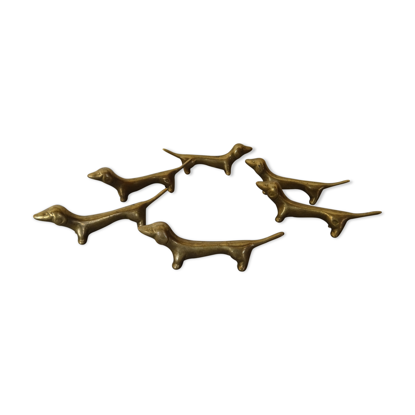 Series of 6 vintage gilded brass dachshund knife holders