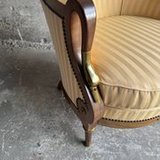 DeCoene antique wood writing desk with beige striped upholstered chair, brass-accented classic set