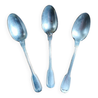 Small old spoons in white metal