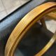 Old oval mirror in gilded wood from the 20th century