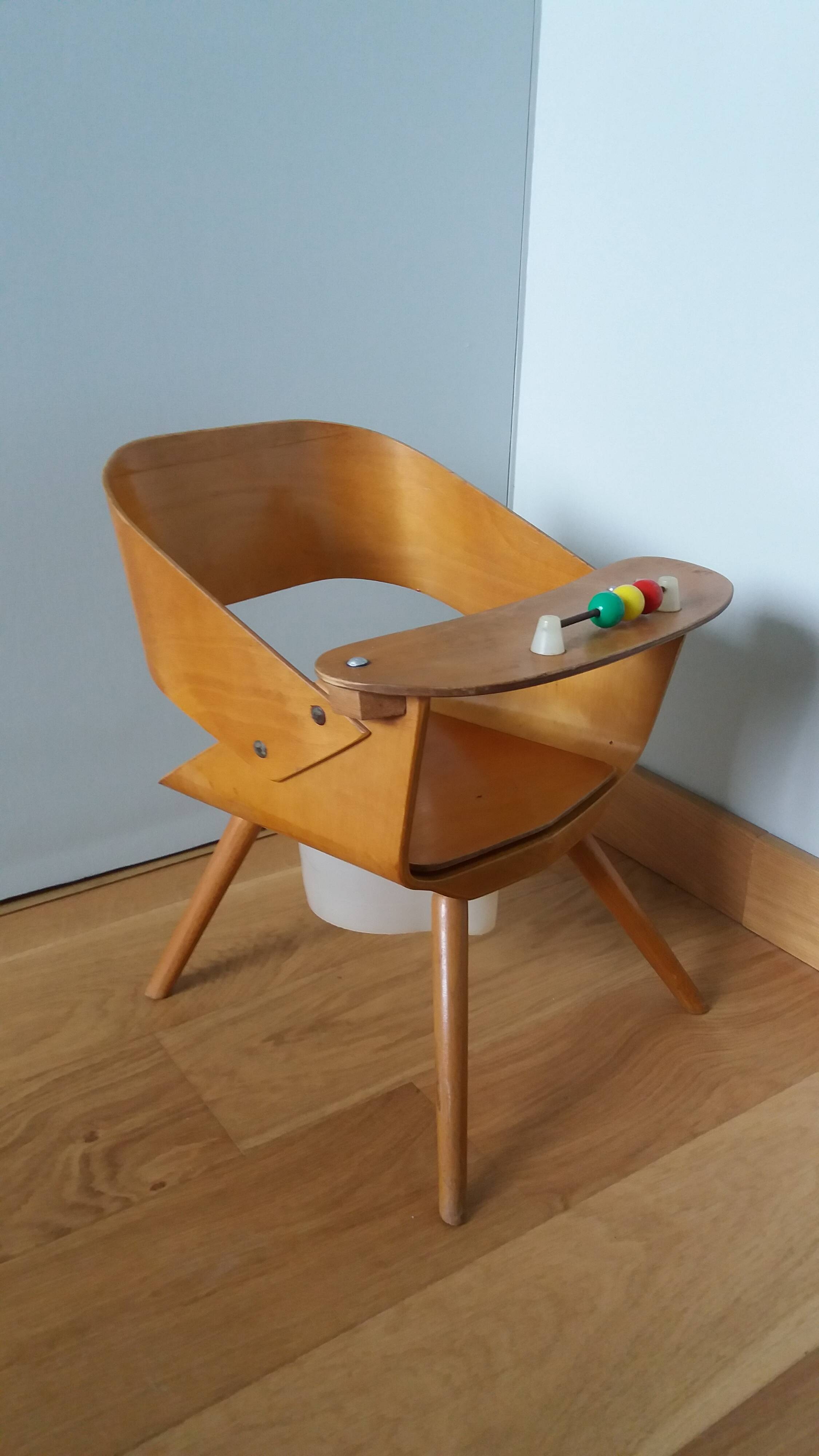 Baumann Baby Coquille children's armchair in bent wood with splayed legs.
