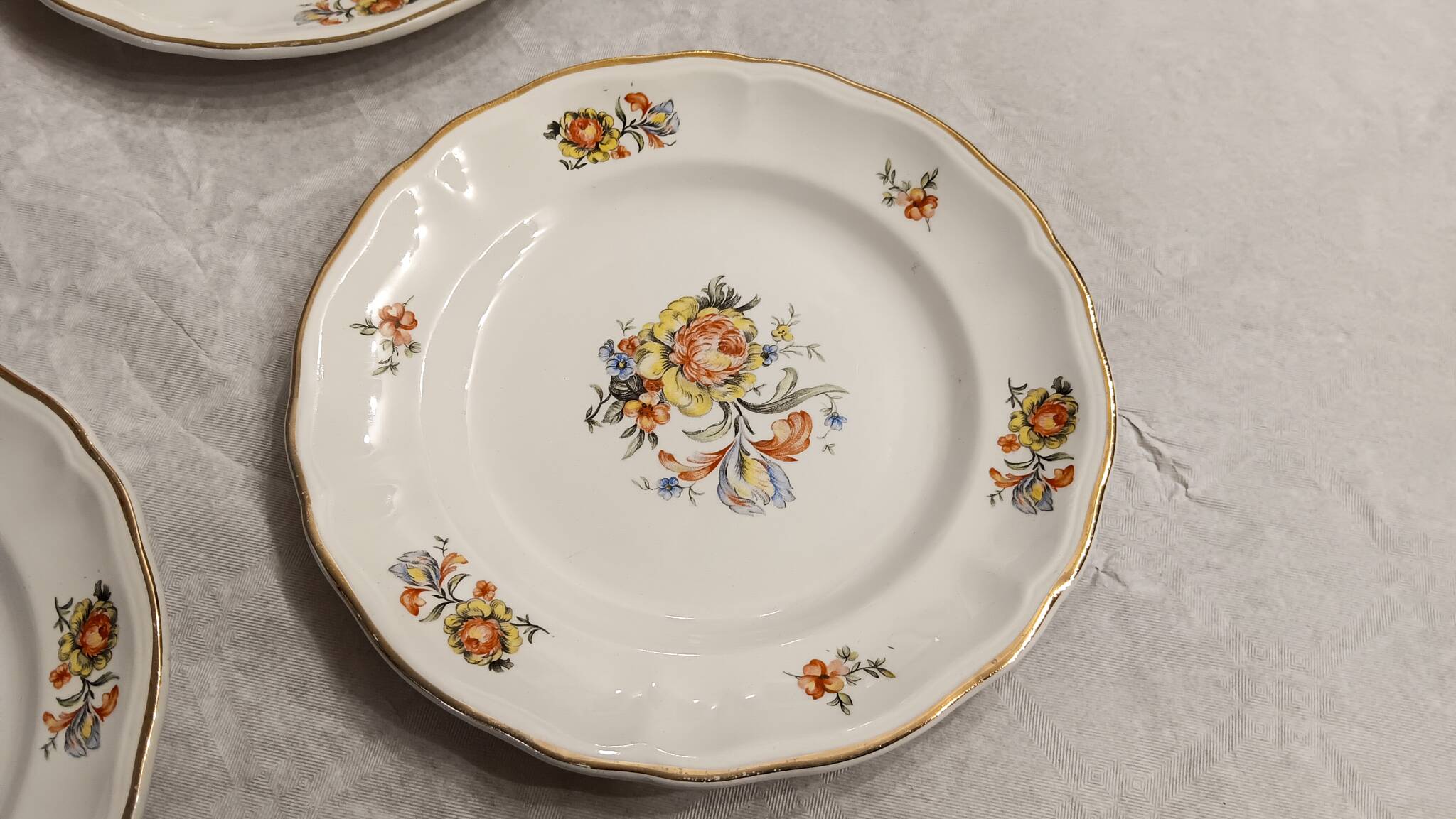 11 starter or dessert plates, KG Lunéville, Marie-Thérèse model - Yellow, blue floral patterns