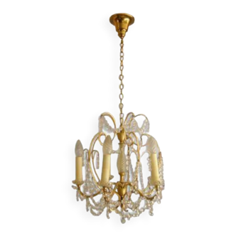 Old chandelier with rhinestone crystal tassels brass body