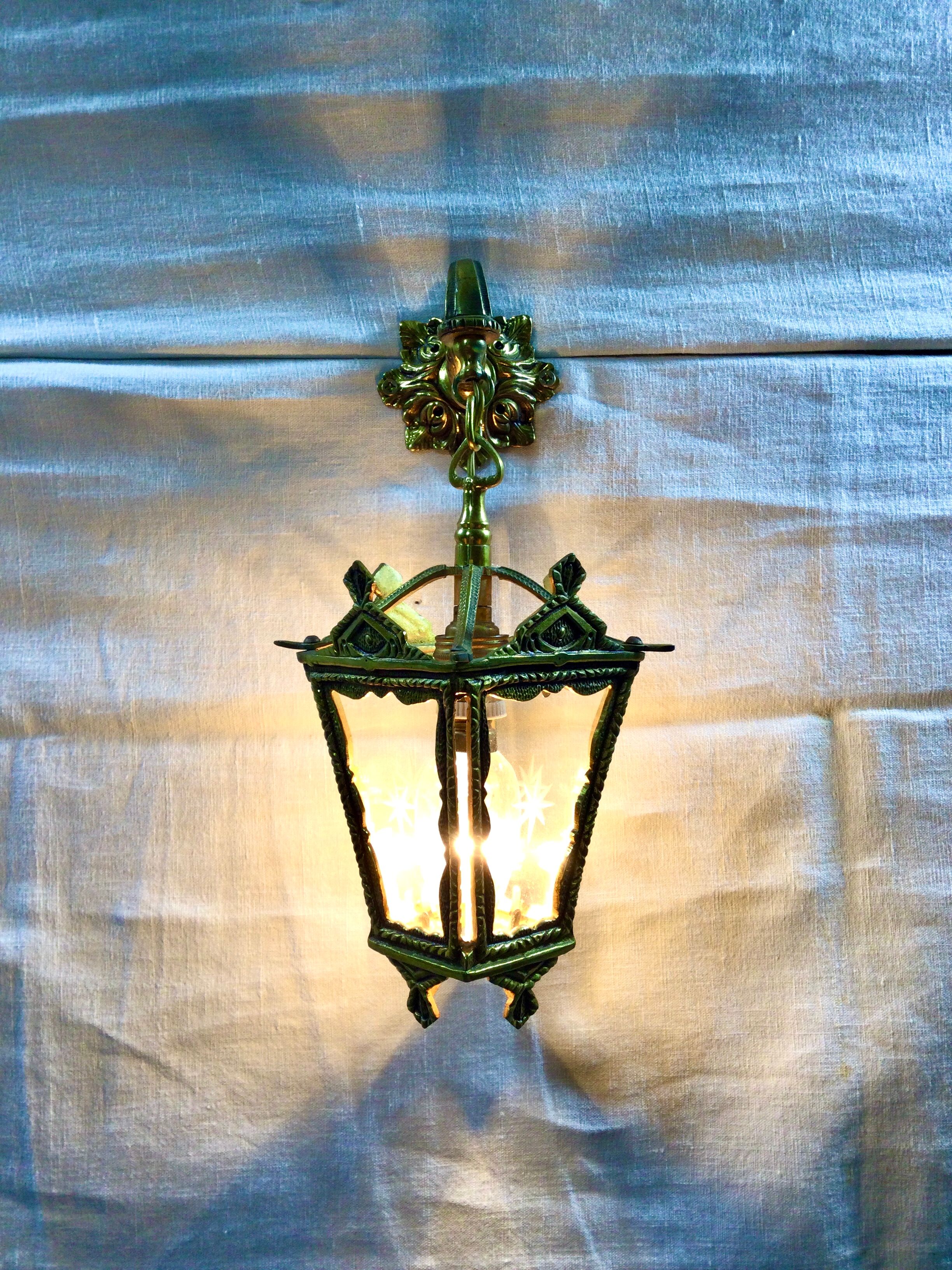 Bronze lantern with starry glasses