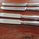 Ercuis - Set of 4 table knives model Chinon with metal outline.