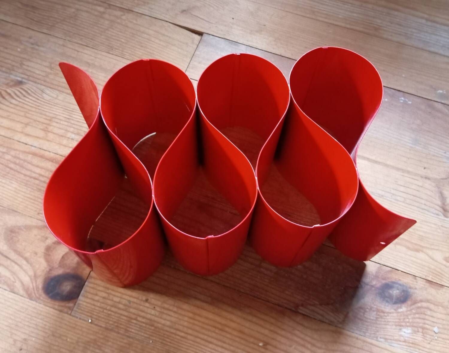 Red painted metal bottle holder, vintage 1980