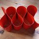 Red painted metal bottle holder, vintage 1980