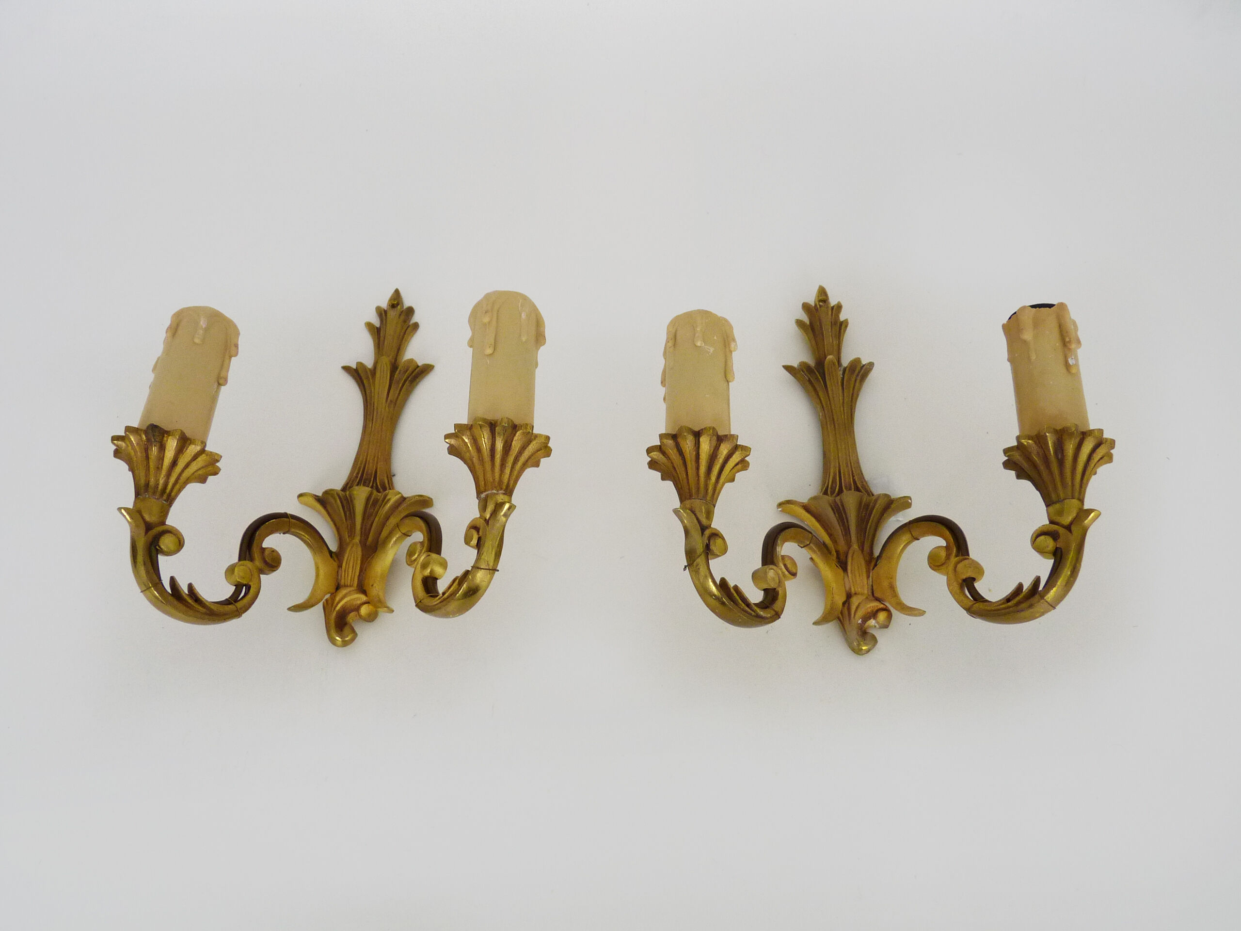 Old pair of wall sconces with double fires in bronze, seventies