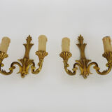 Old pair of wall sconces with double fires in bronze, seventies