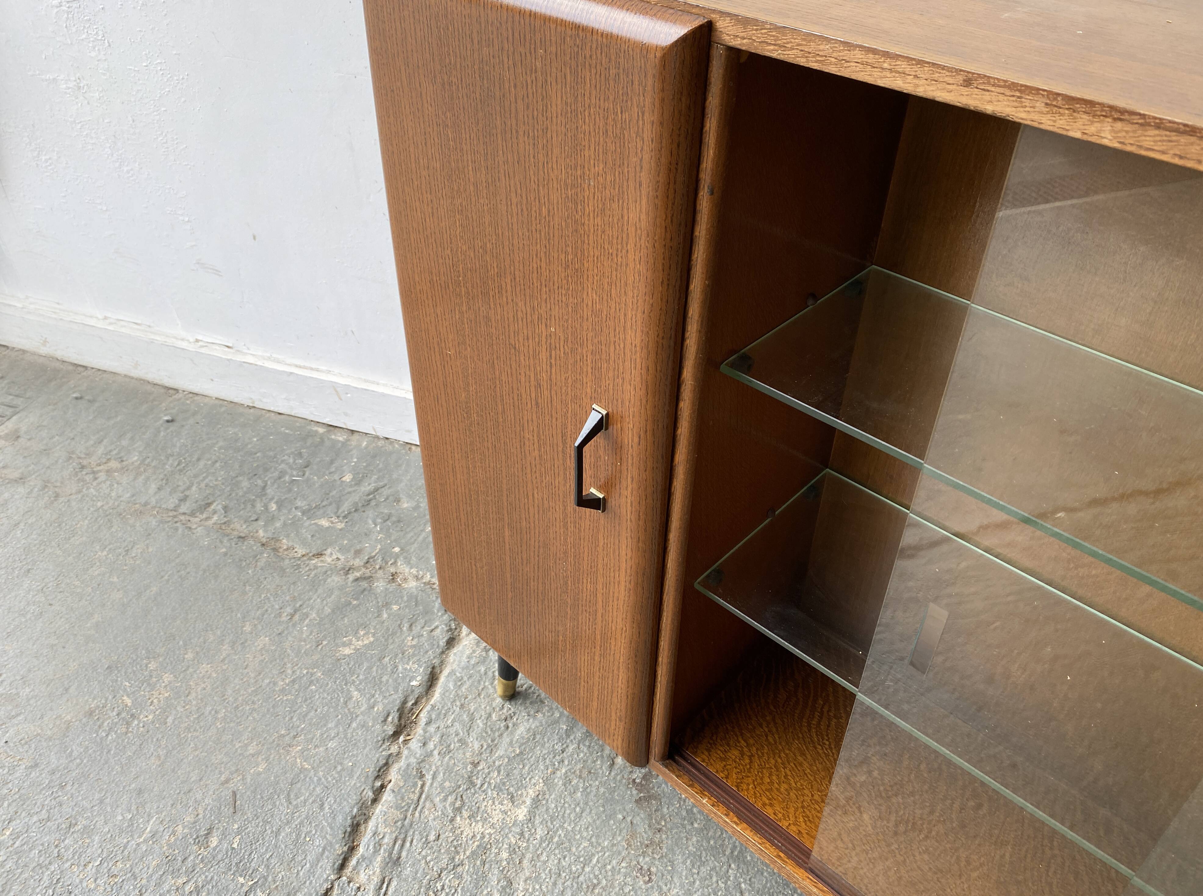 Mid Century vintage  bookcase with sliding glass doors by Turnidg