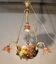 Bronze three-armed chandelier with a grape decoration.