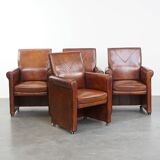Vintage set of 4 sheepskin leather dining chairs on castors