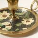 Set of 2 round golden metal candle holders and floral patterns
