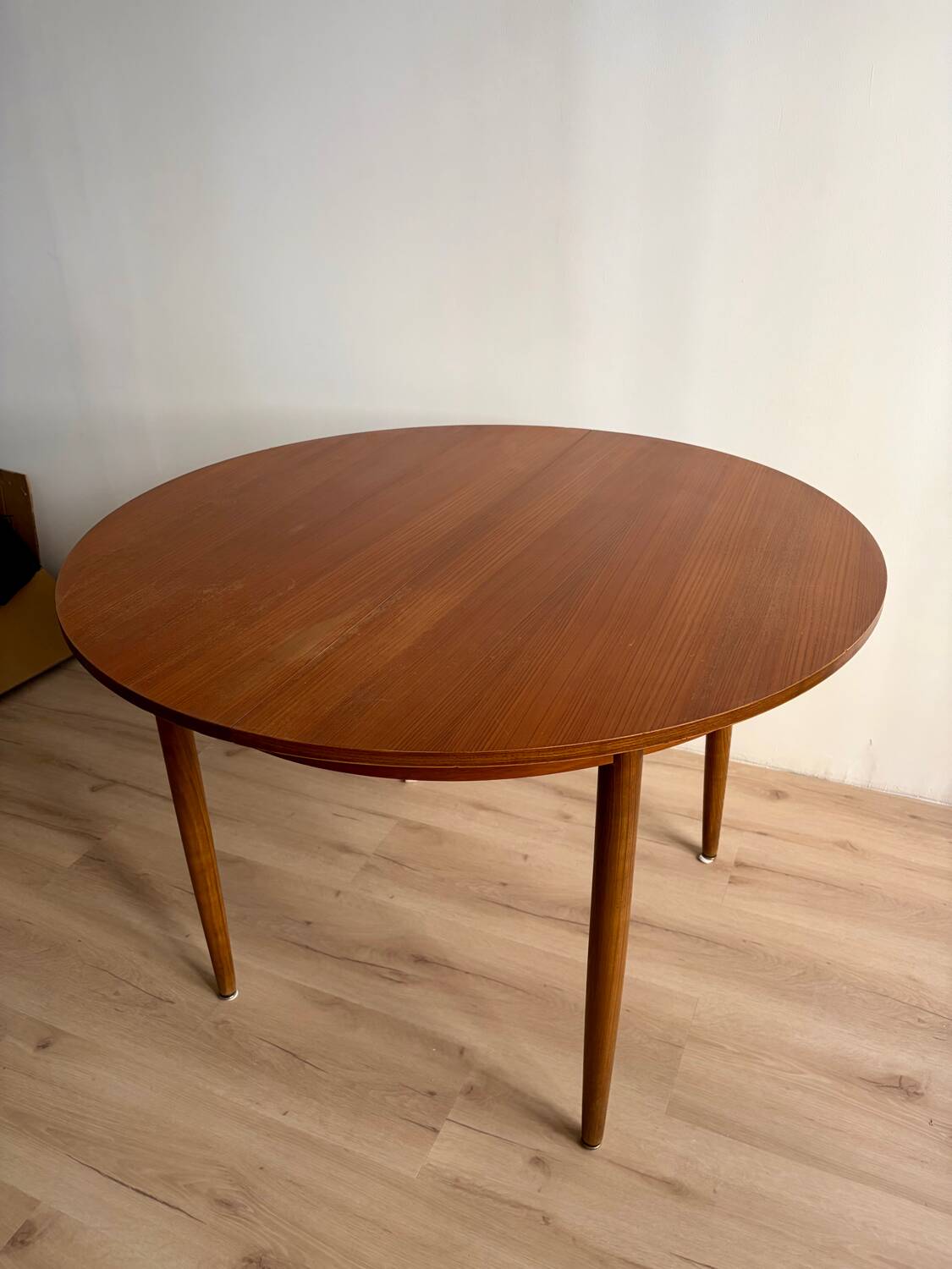 Vintage Scandinavian round table from the 50s and 60s in extendable teak with ra.