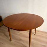 Vintage Scandinavian round table from the 50s and 60s in extendable teak with ra.