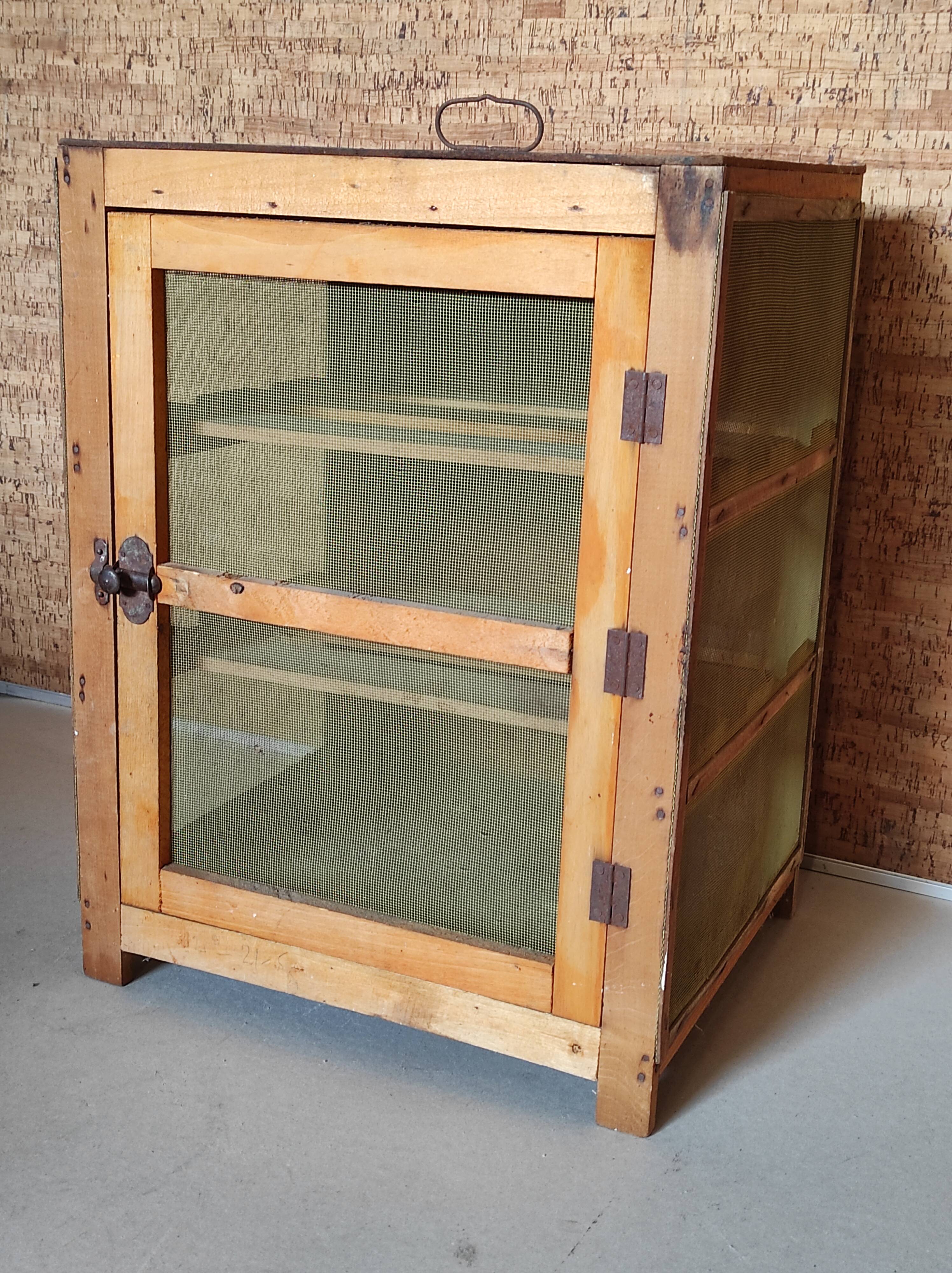 Small pantry cabinet in vintage wood mesh