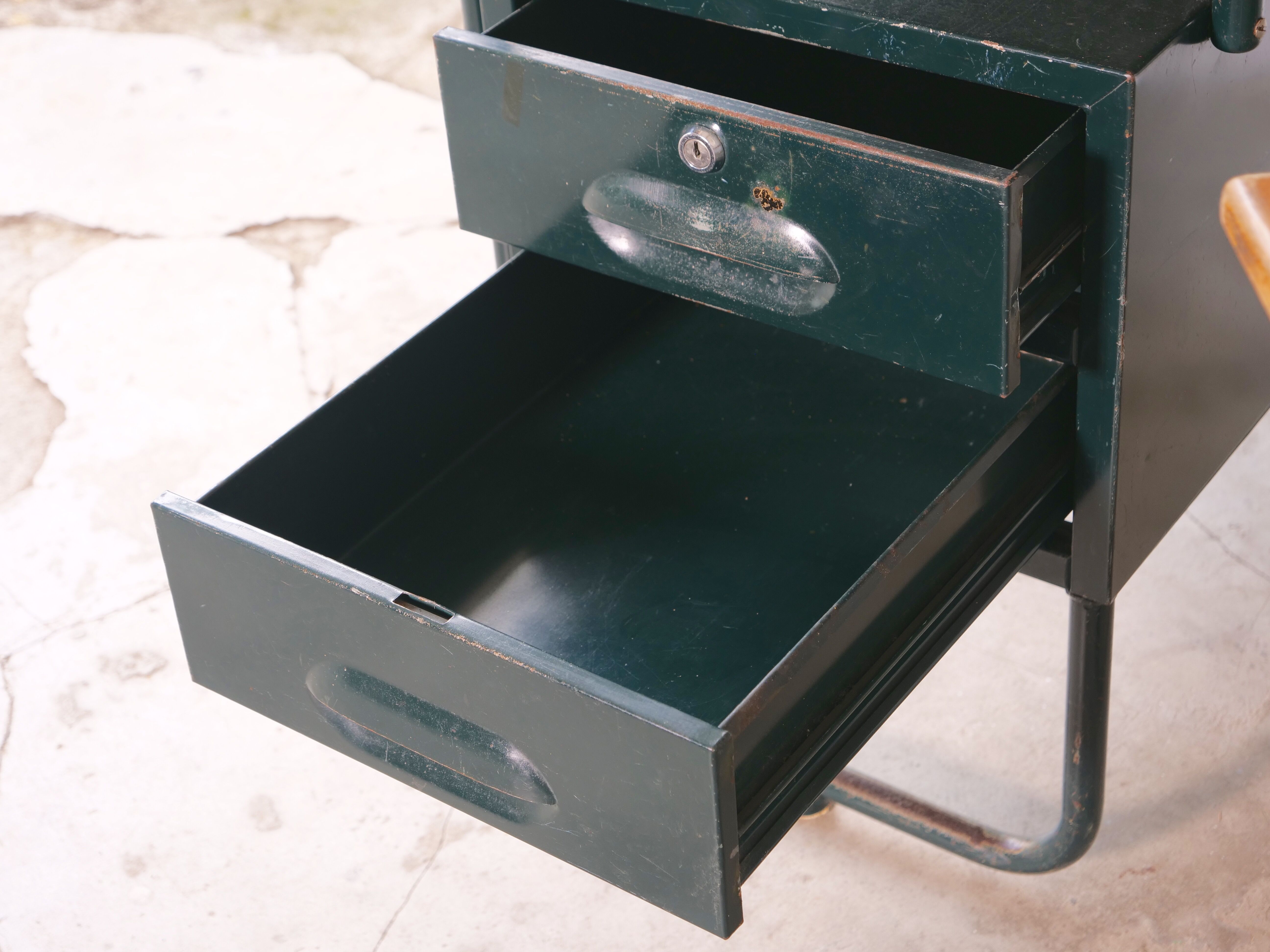 Desk with bauhaus style tubular steel chair