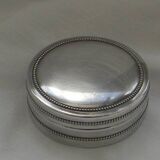 Small round silver metal box SNPA.
