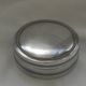 Small round silver metal box SNPA.