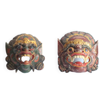 Two polychrome painted and gold leaf gilded Barong dance masks from Bali, Indonesia.