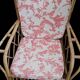 Vintage rattan garden furniture with cushions.