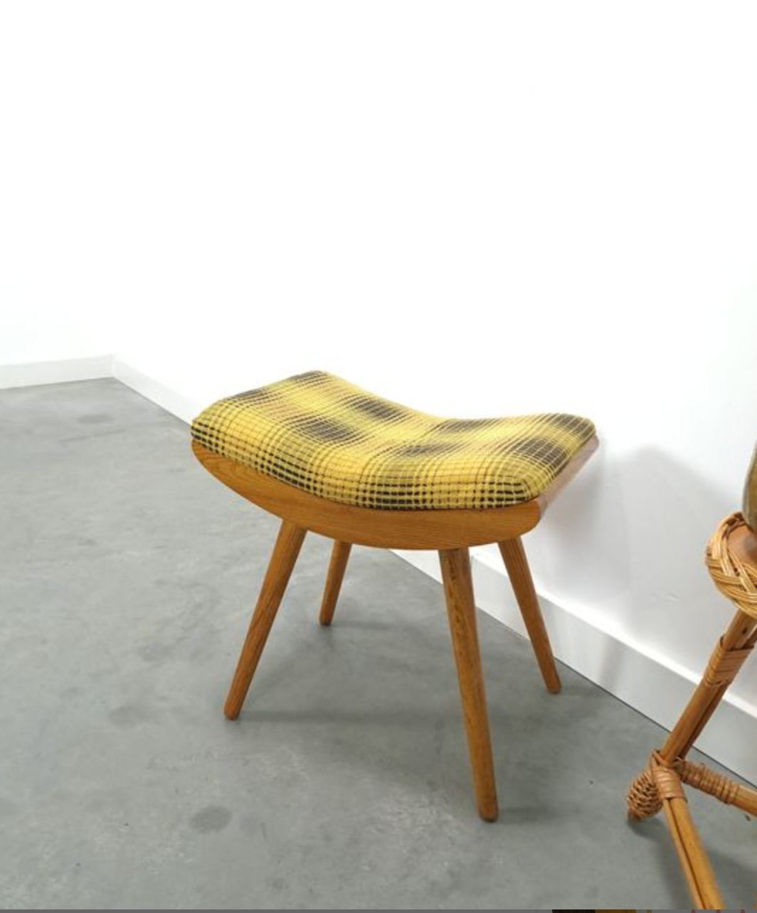 Vintage footrest with checkered cushion