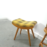 Vintage footrest with checkered cushion