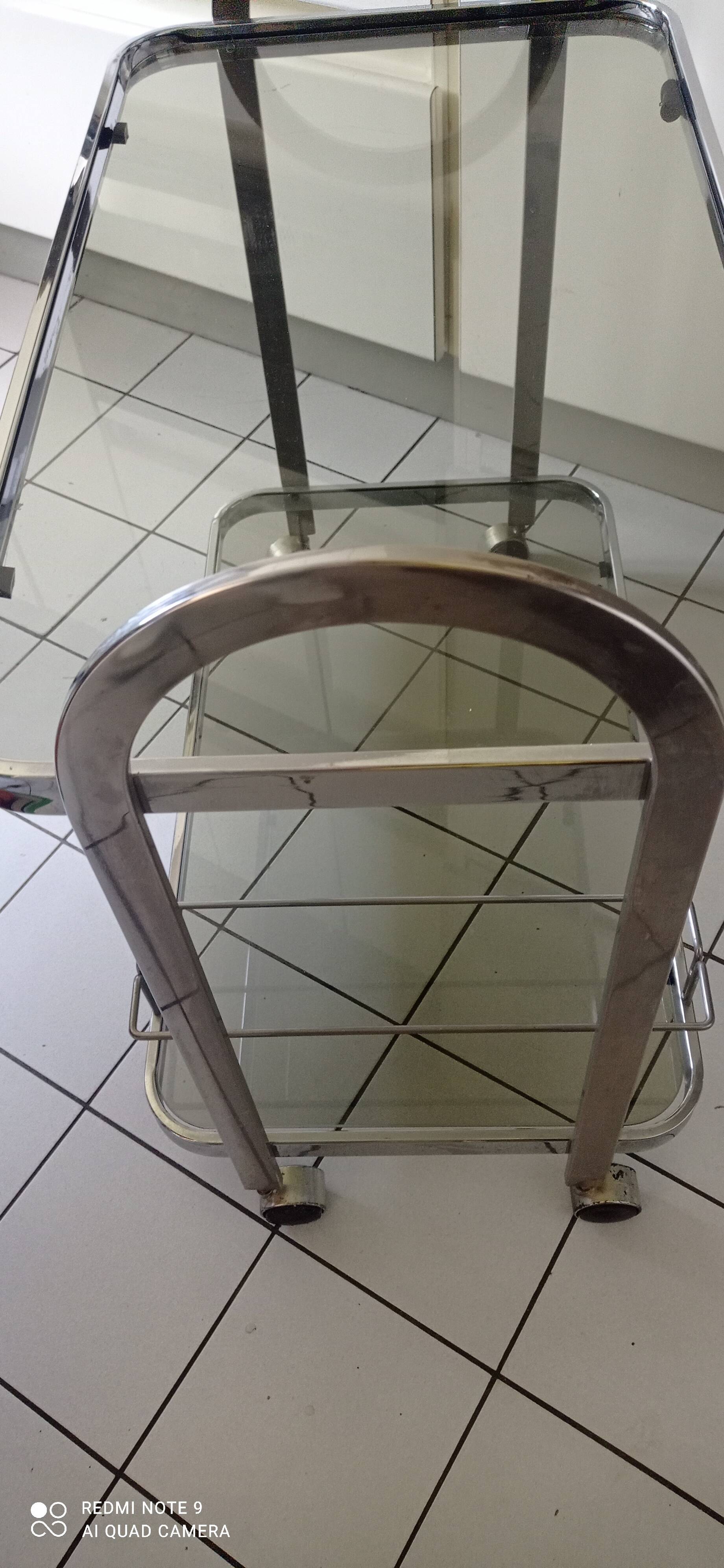 Vintage rolling trolley in smoked glass