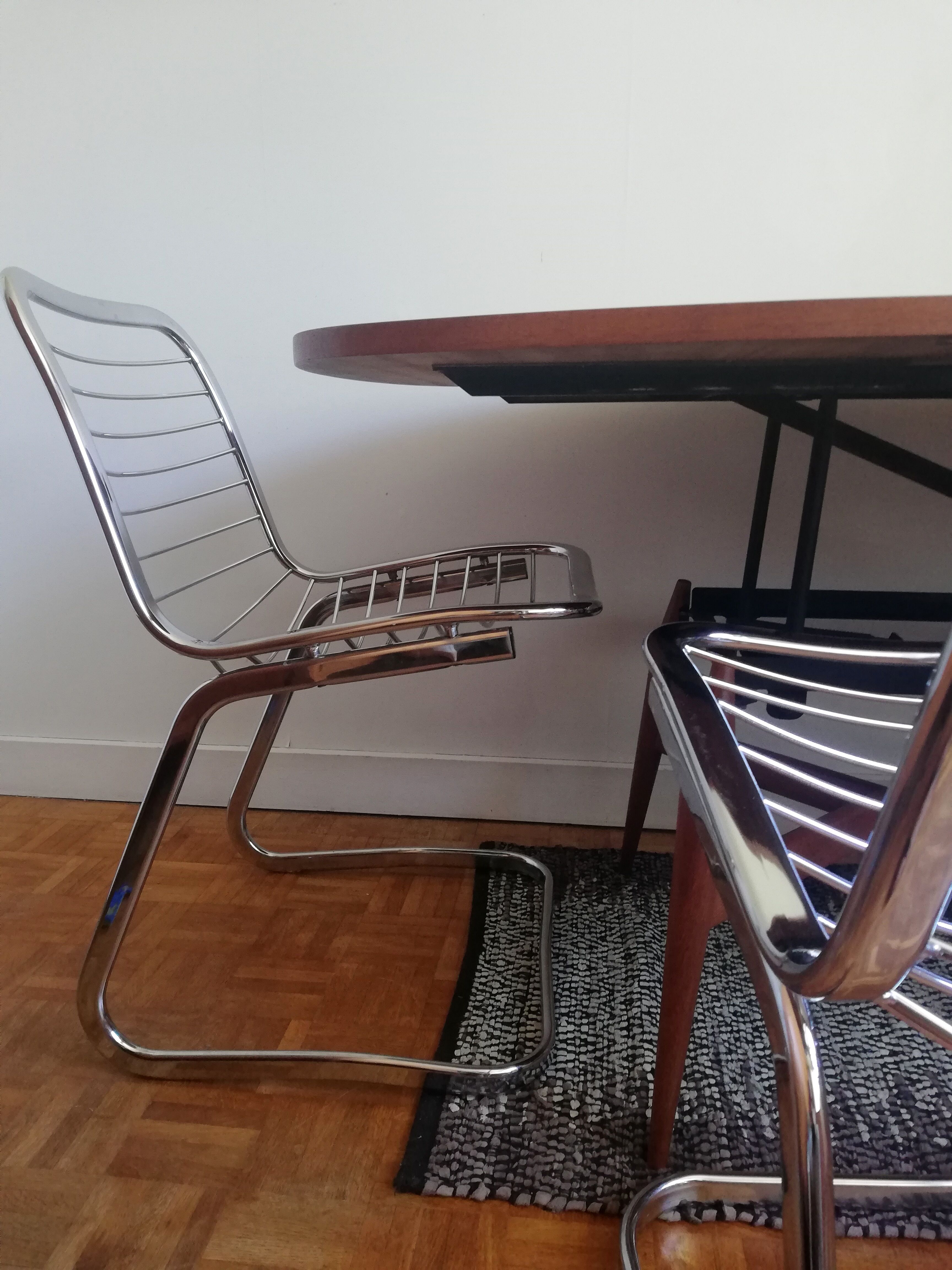 2 chrome wired chairs