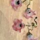 Pair of brass sconces and pink glass