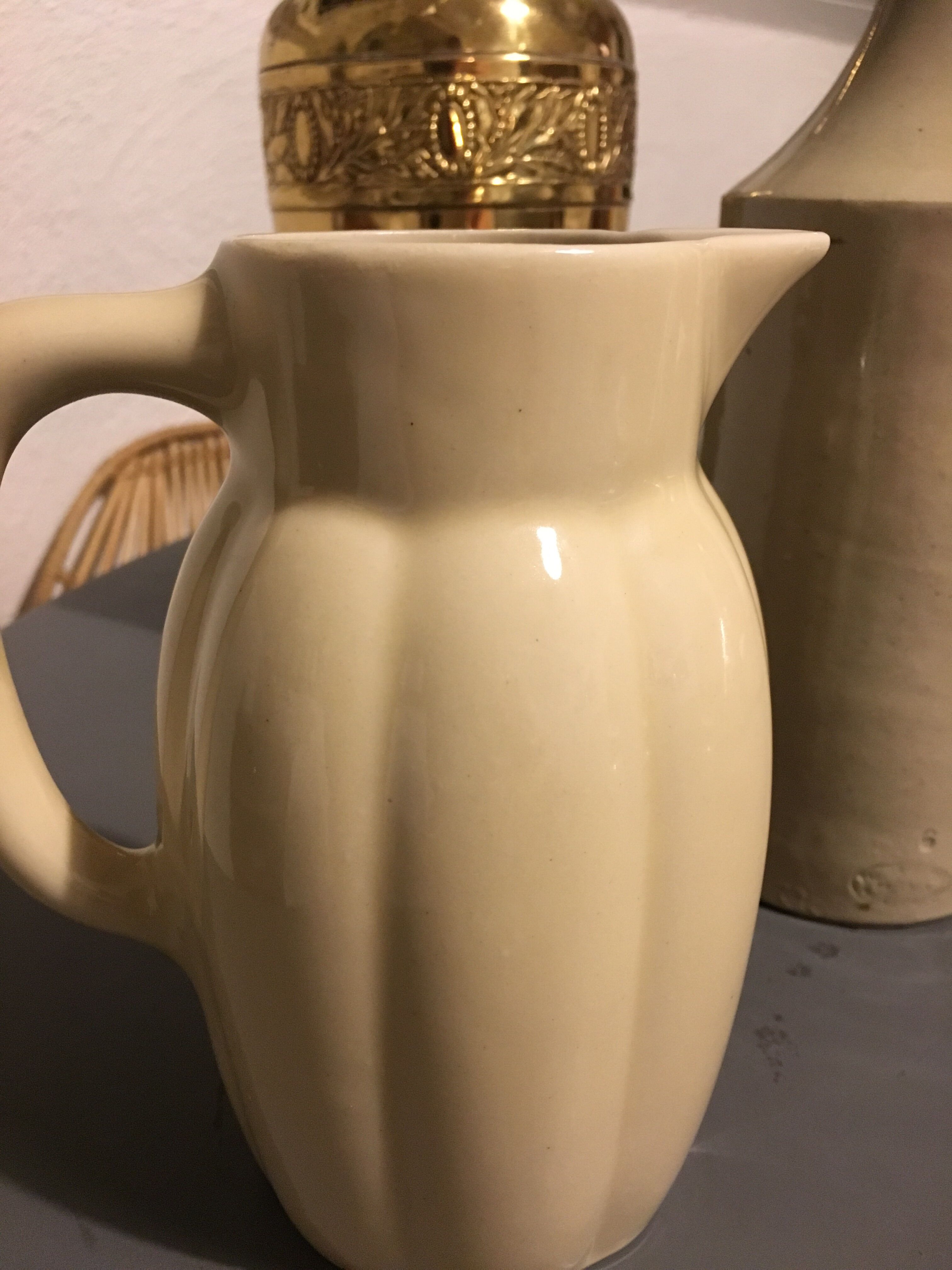 Cream color earthenware pitcher