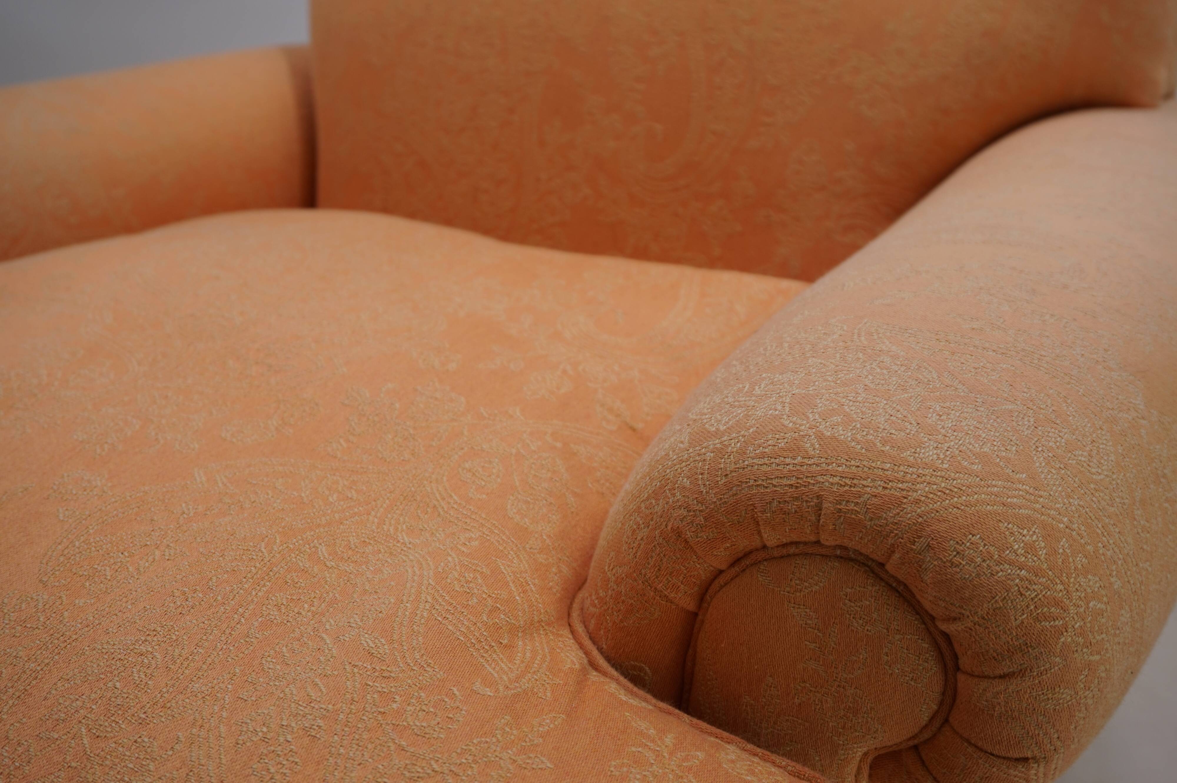 Deep seated armchair in the style of Howard & Sons