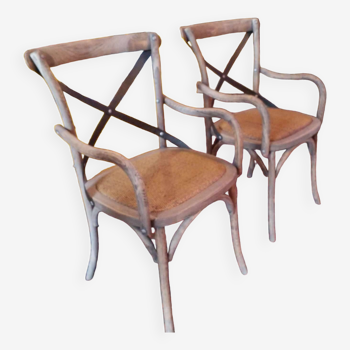 Angled wooden armchairs