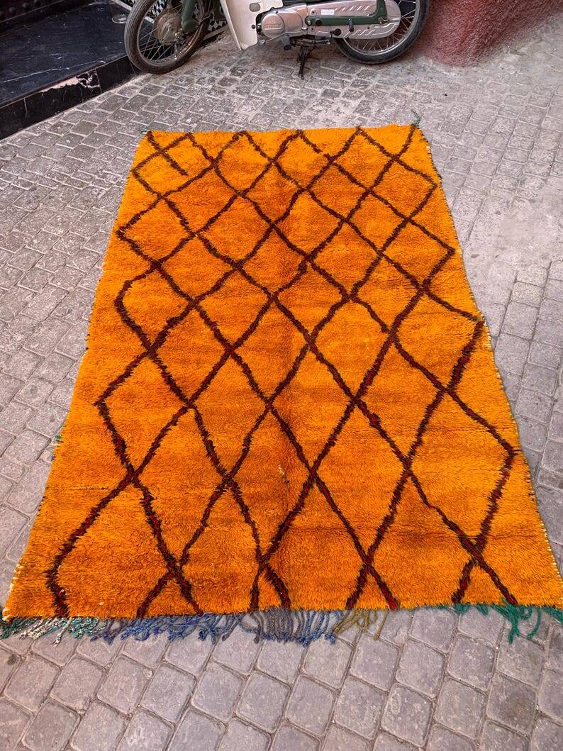 Beni oren art rug, handmade moroccan rug, yellow black red rug, abstract yellow rug.