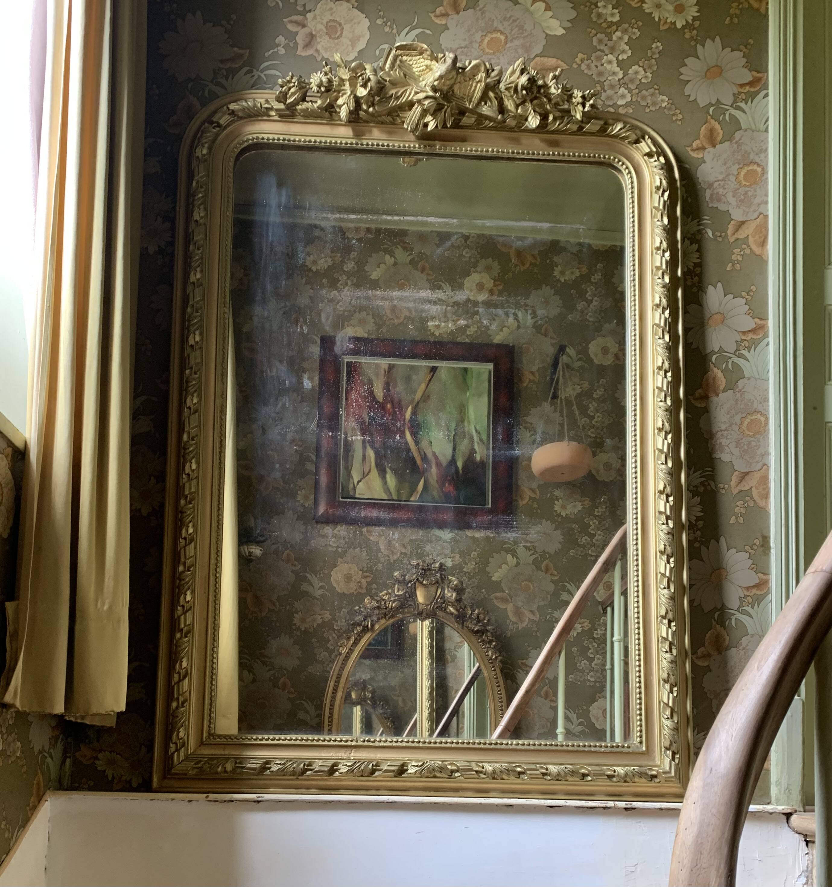 Gilded wooden fireplace mirror with pediment