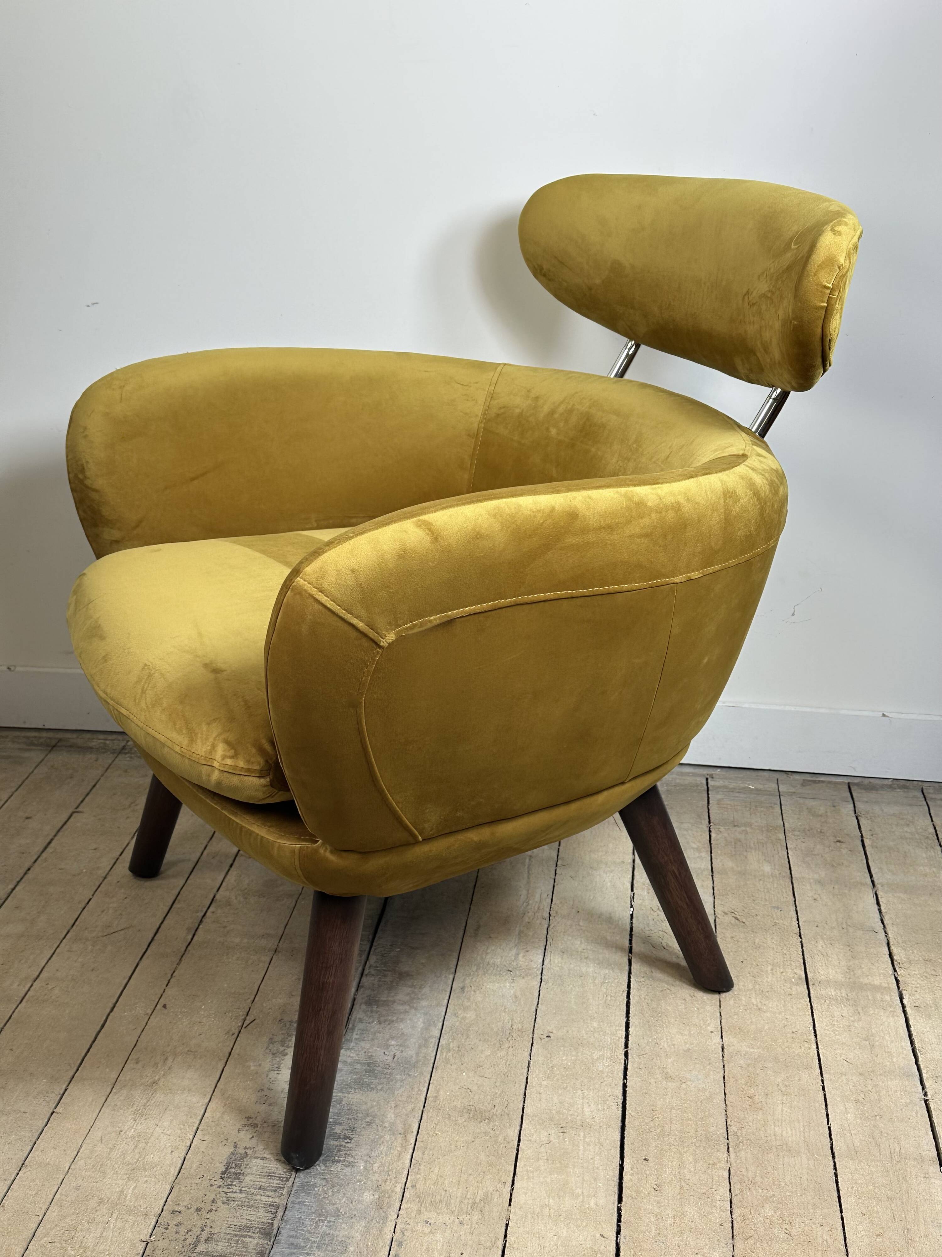 Mustard yellow velvet armchair from the 2010s.