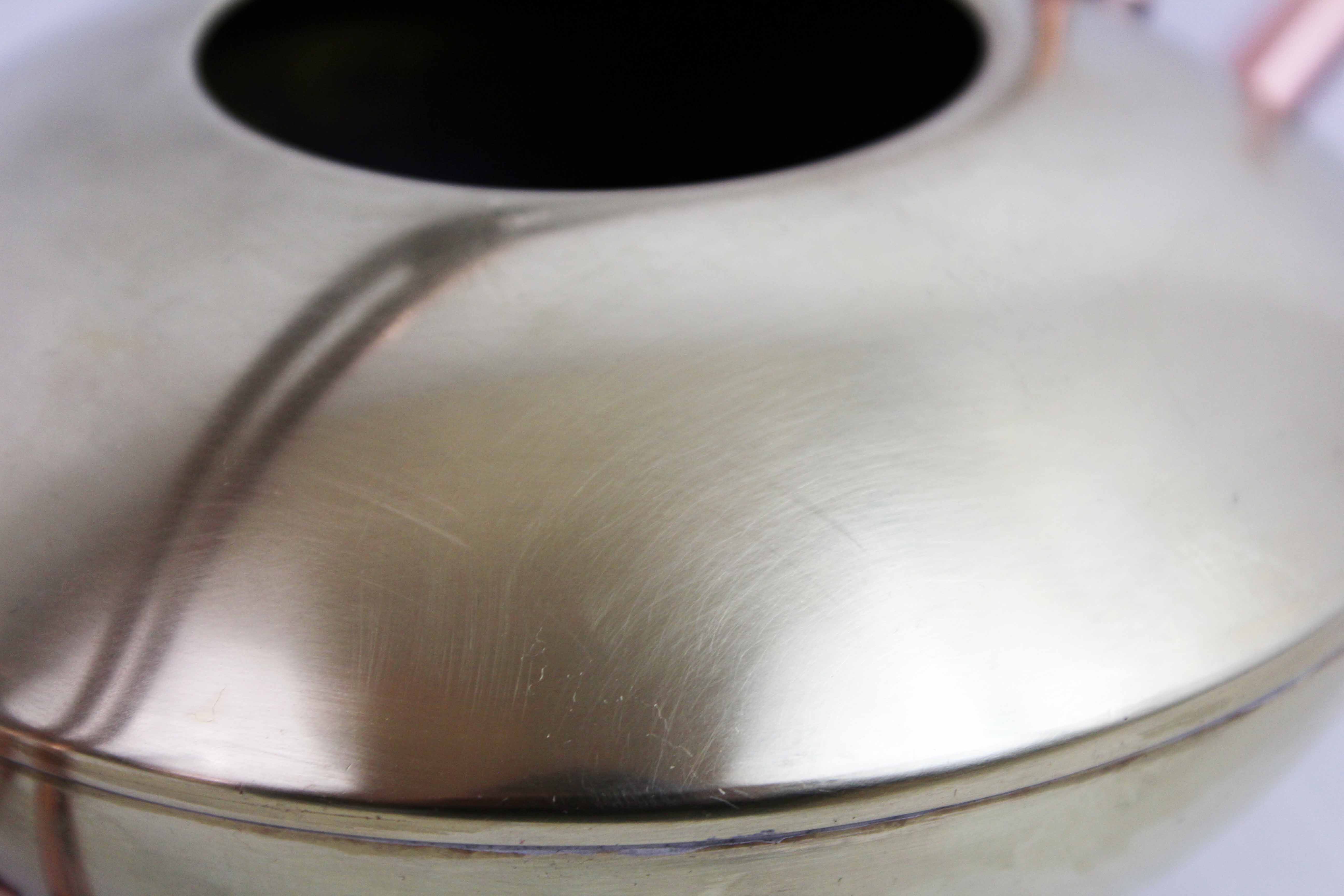 Watering can in brass and copper